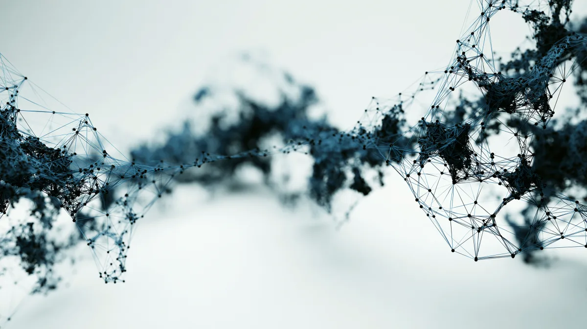 Soft wave of teal particles drifting across a pale background